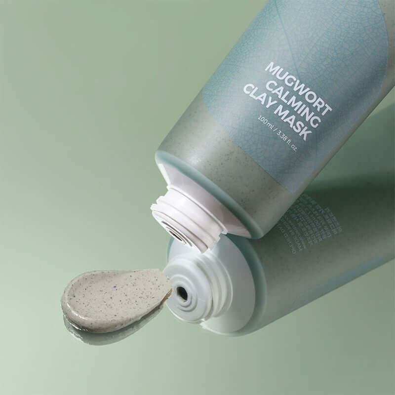 Isntree Mugwort Calming Clay Face Mask 100ml tube with mask texture on surface, ideal for oily and combination skin types.